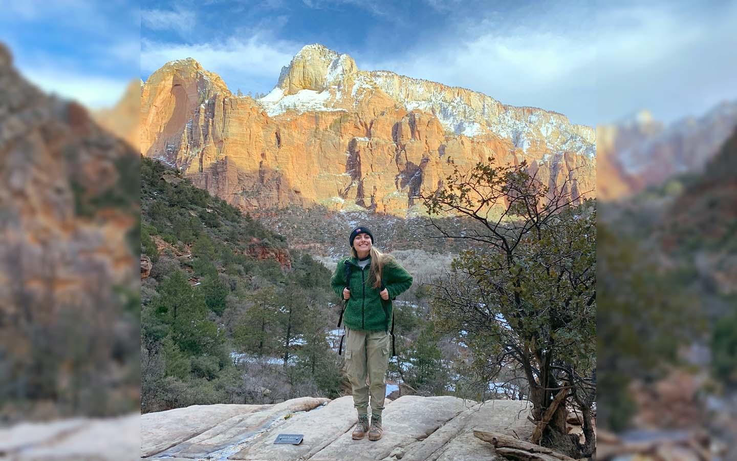 Jordyn Berg wearing a backpack and hiking in Zion National Park
